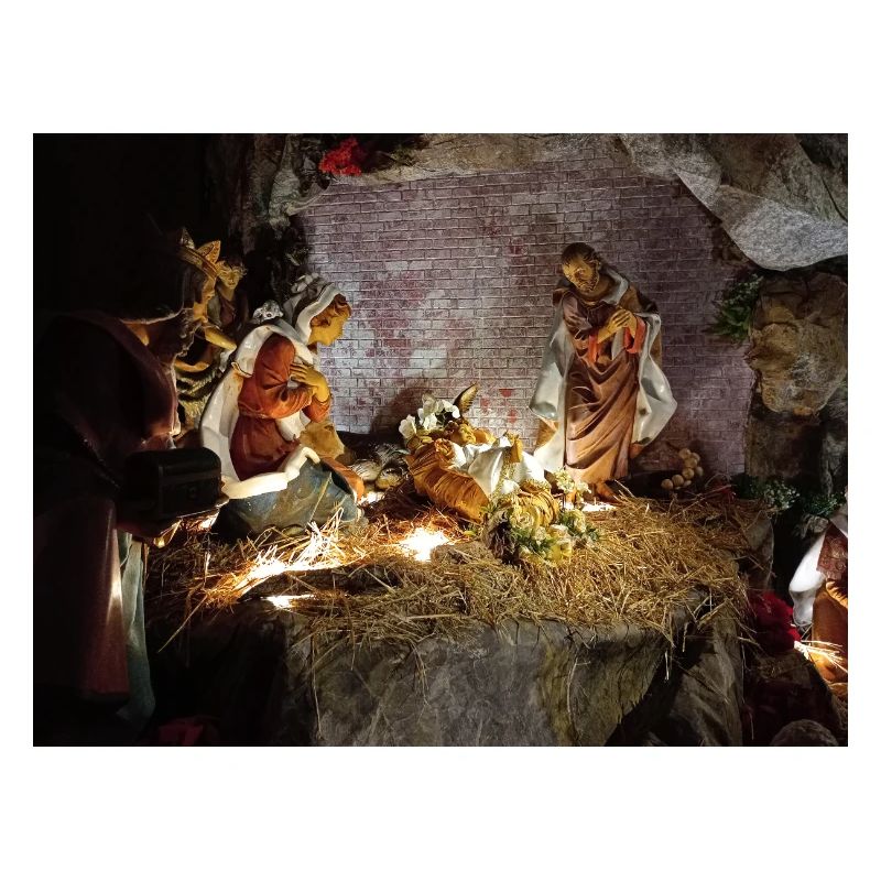 Illuminated Nativity Scene between Stones