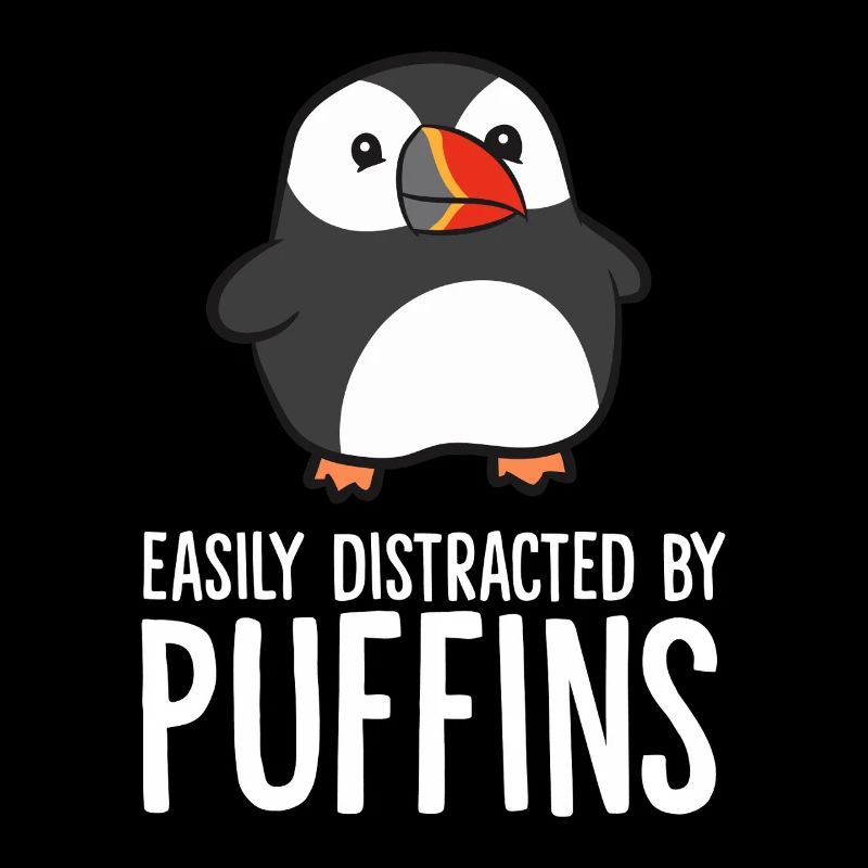 Pinguin wird von Papageitauchern abgelenkt