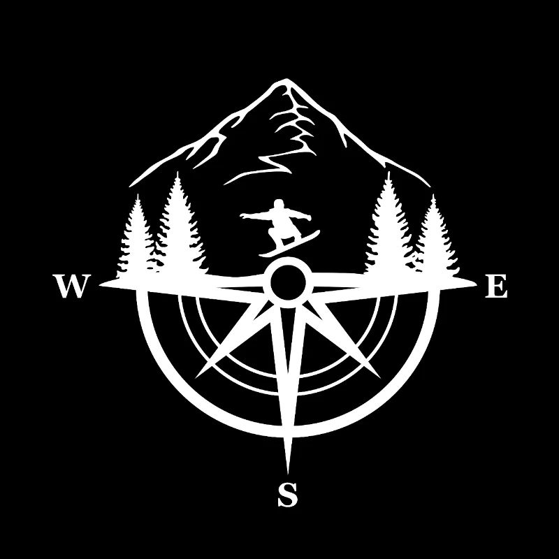 Snowboarder and compass in the mountains