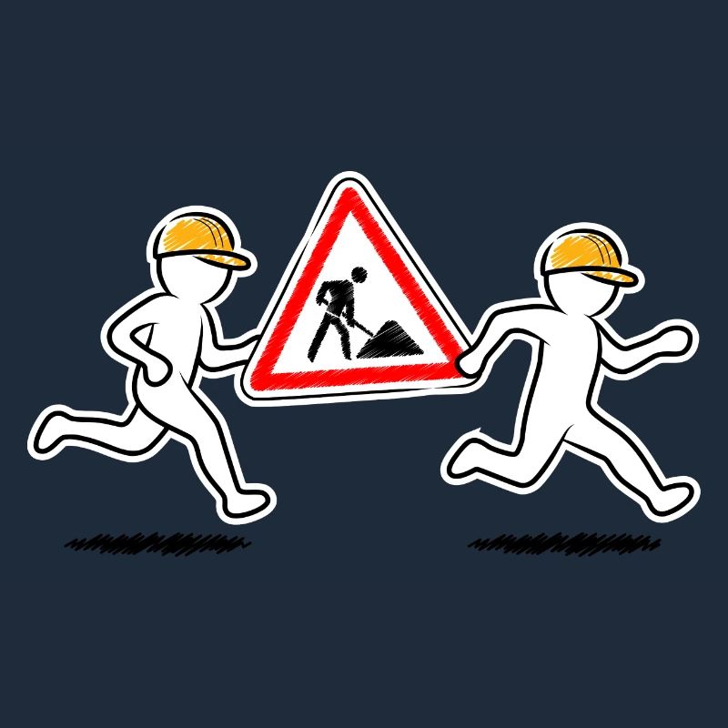 Two construction workers carry a construction site sign