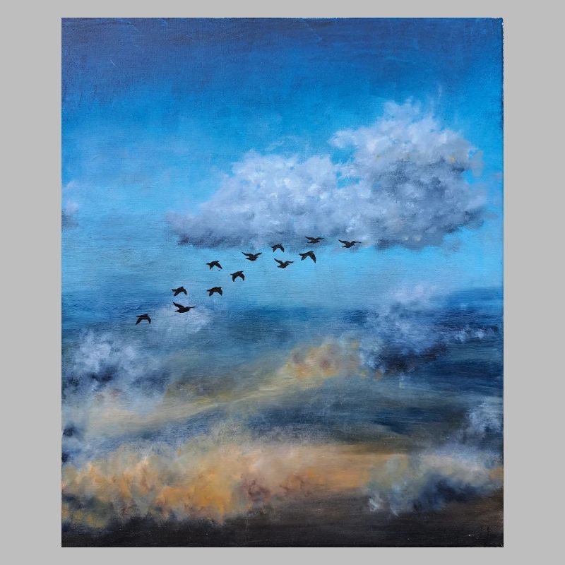 Birds in Flight Over a Cloudy Sky