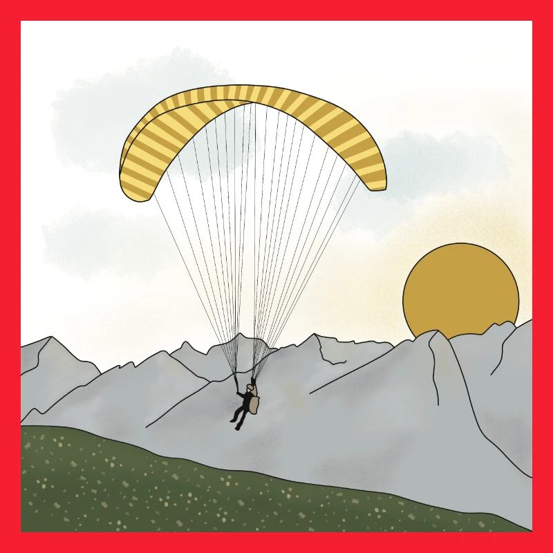 Paraglider sailing in the mountains sunset