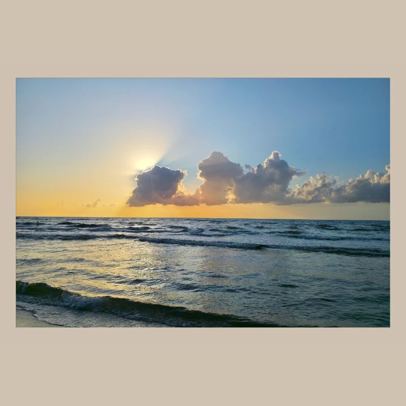 Sunset over the sea with clouds