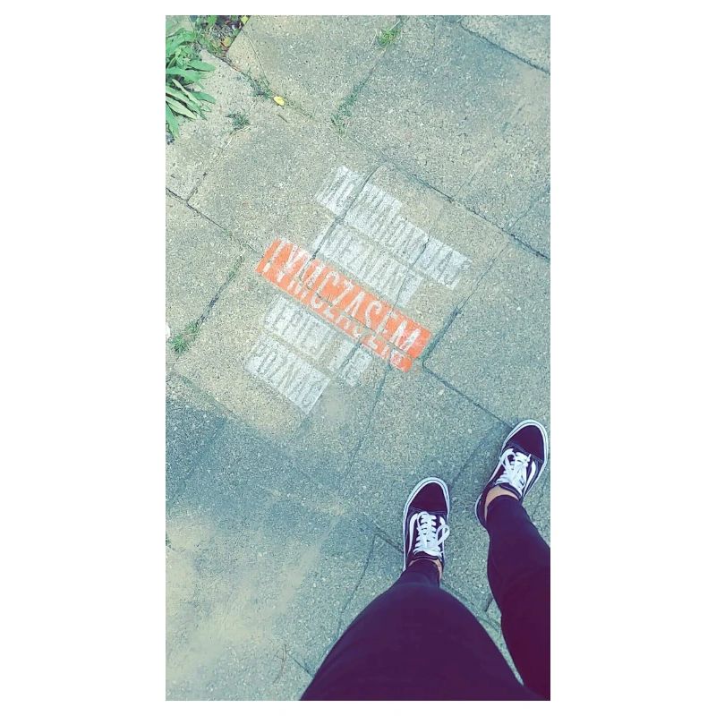 Graphics on the sidewalk with a cross-out