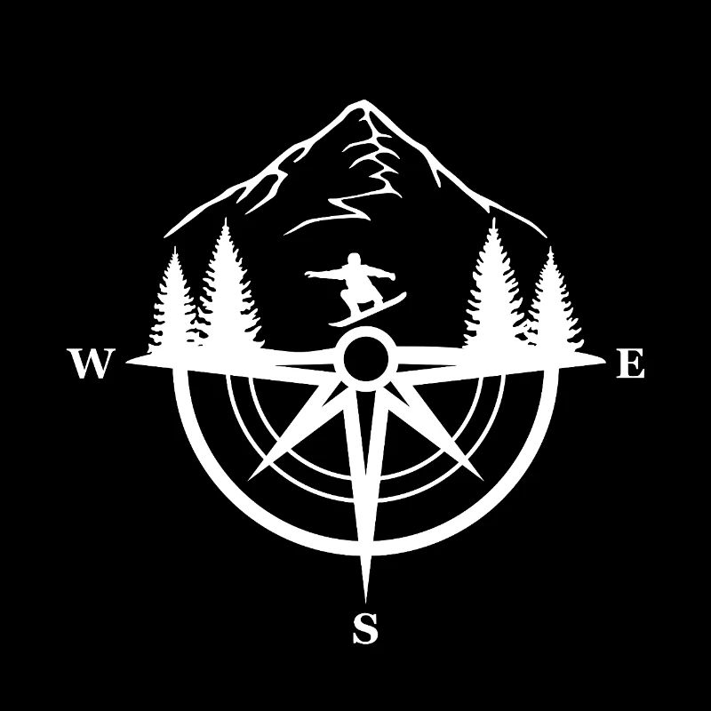 Snowboarder and compass in the mountains