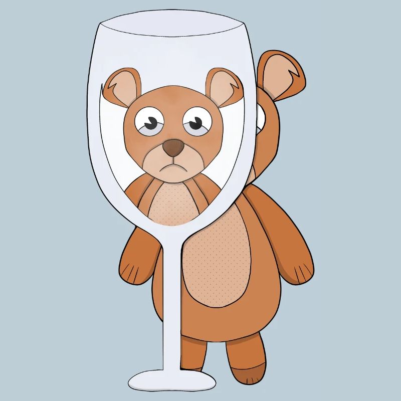 A teddy bear and empty glass