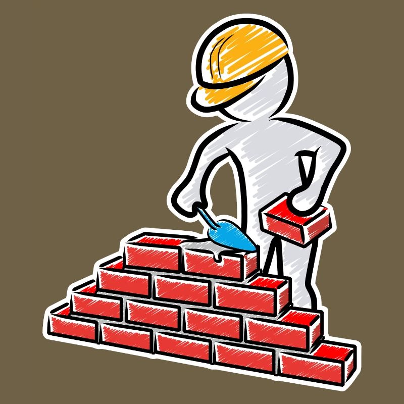 Construction worker with trowel, mortar and wall
