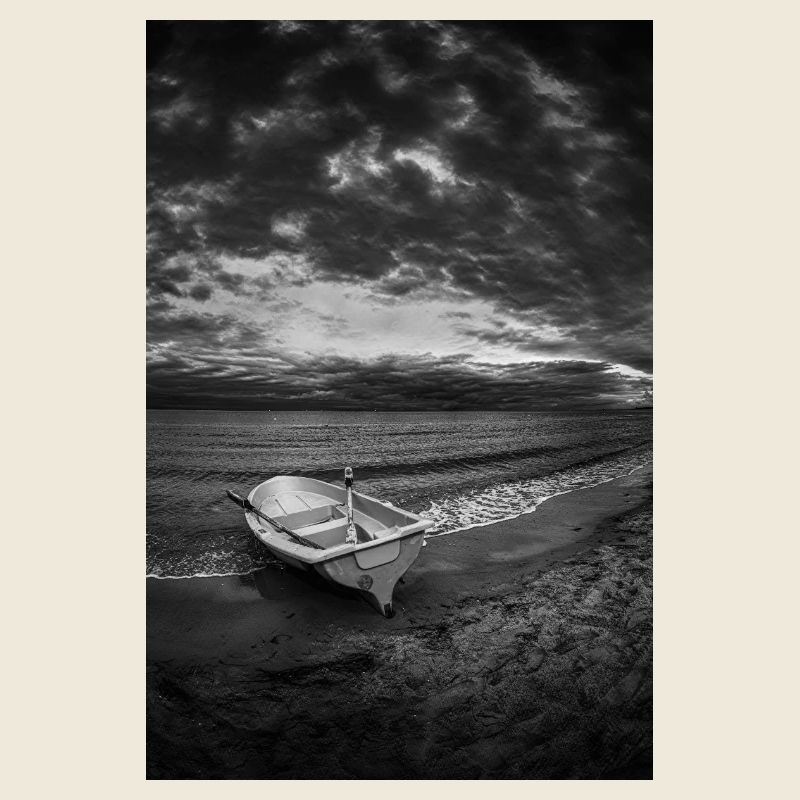 A boat on a dark shore