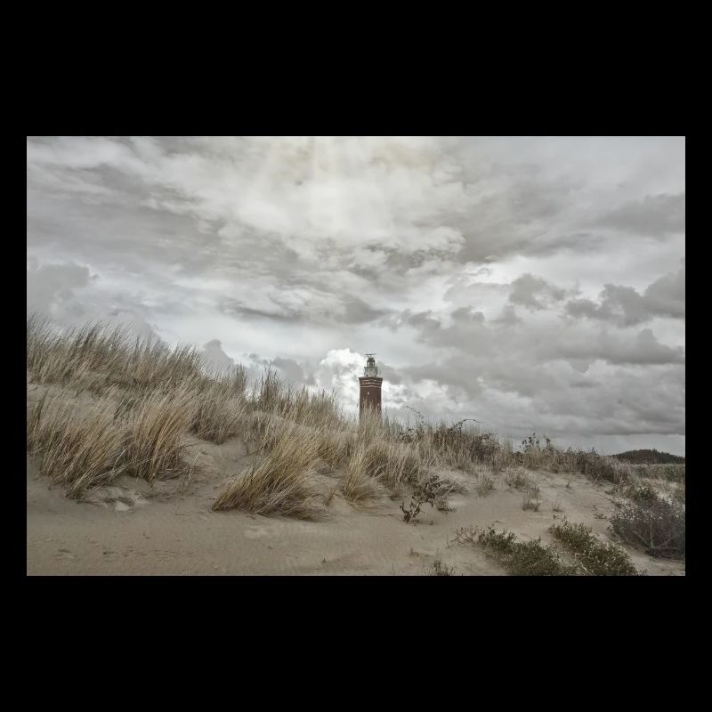 Lighthouse behind the dunes