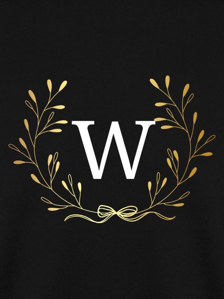 Buchstabe mit goldener Blumenkrone