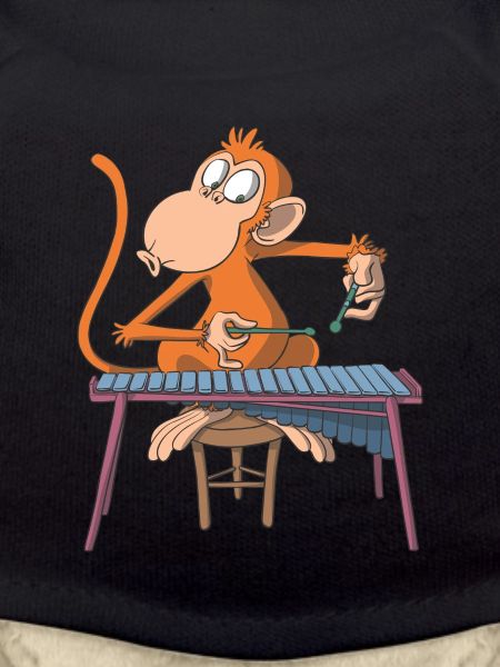 Monkey plays marimba xylophone