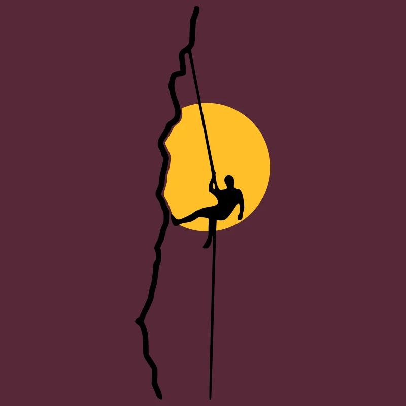 Climber rappelling in the sunset
