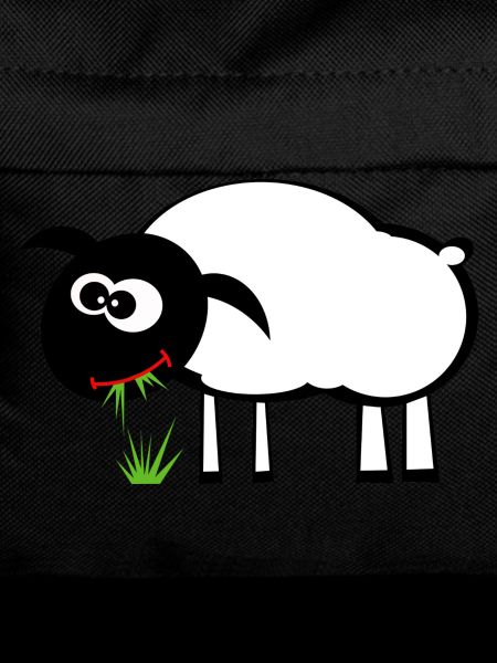 Sweet sheep eats grass. Gift