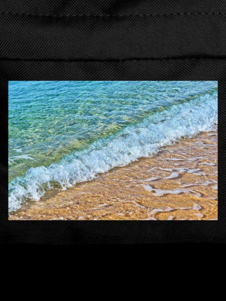 Crystal waves on golden sand beach