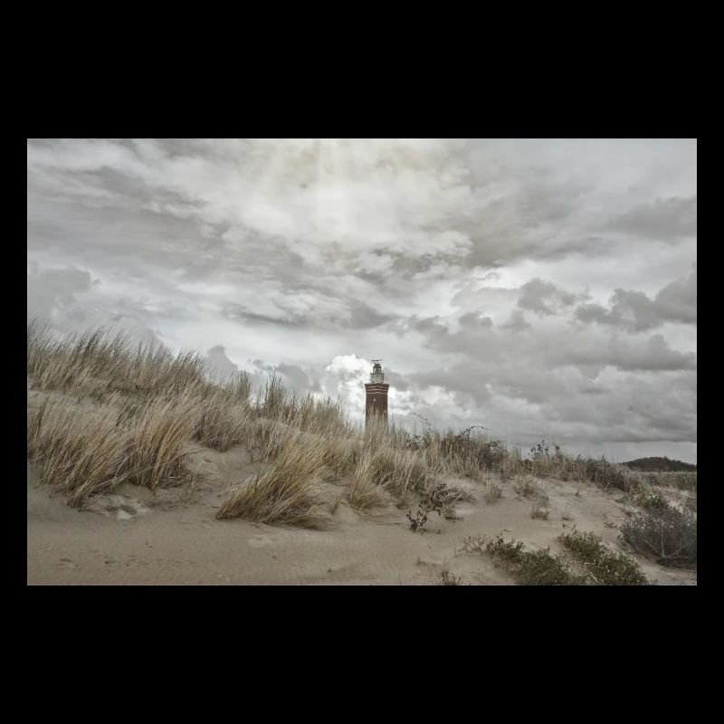 Lighthouse behind the dunes