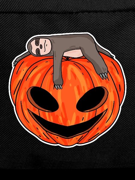 Sloth sleeping on pumpkin