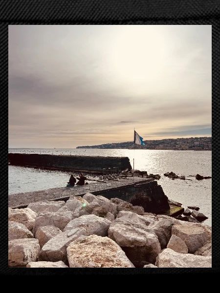 Sunset over pier and rocks