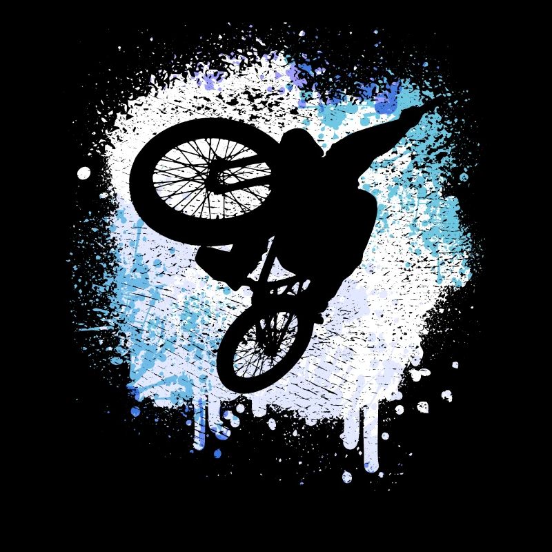 Mountain biker jumps through the snow in winter