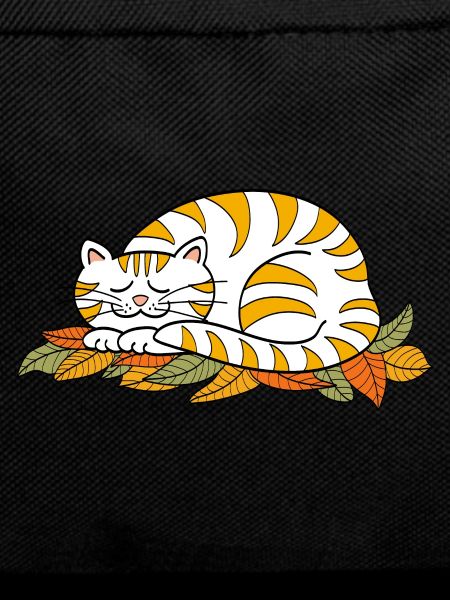 Sleeping kitty on autumn leaves