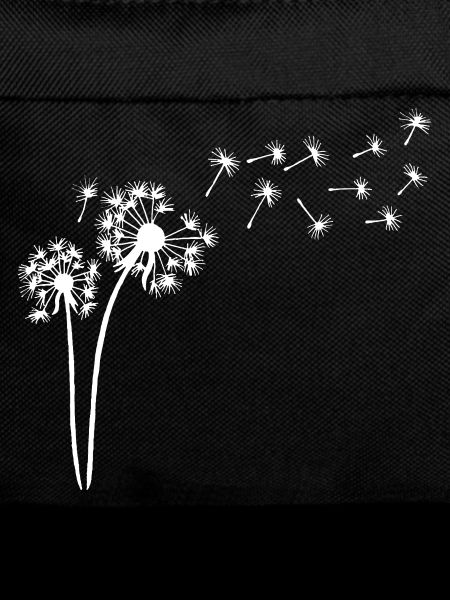 White dandelion in the wind