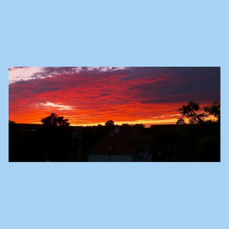 Sunset Silhouette Over City