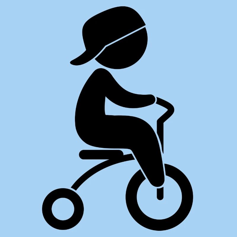 Boy Riding His Tricycle
