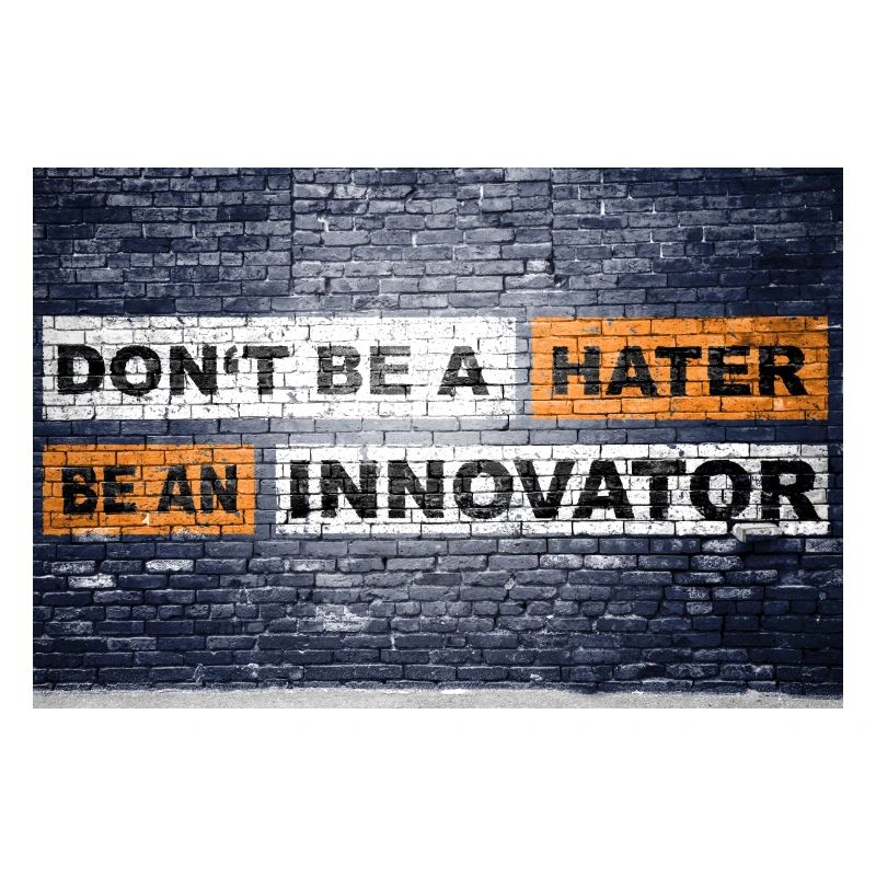 Don't be a hater be an innovator brick wall