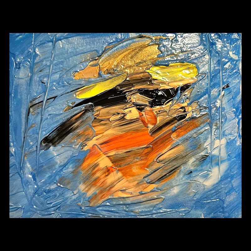 Blauer Farbwirbel im Orange