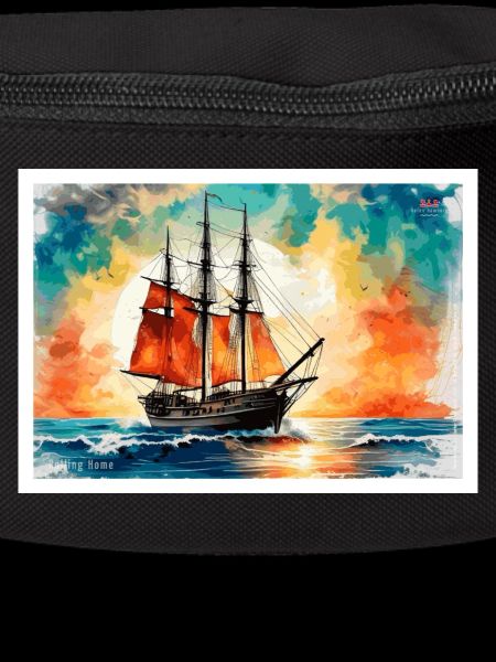 Red sailing ship at sunset