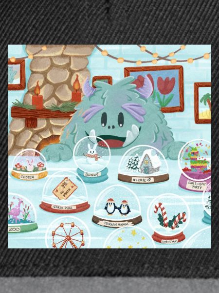 Flauschiges Wintermonster mit Schneekugel-Sammlung