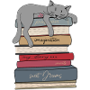 Cat sleeps on books