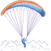 Paragliders fly over mountains