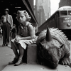 Child sits next to Dino