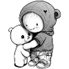 Child cuddling with teddy bear