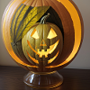 Glass ball with Halloween pumpkin