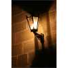 Night lantern on brick wall