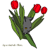 Cat between tulips