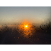 Sun behind glass
