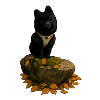 Black Spitz Dog on Tree Trunk