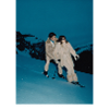 Elegant skier couple in snowy landscape