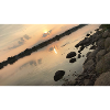 Sunset over the river with stones