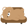 Tired Polar Bear on Sofa
