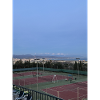 Panorama Tennisanlage über Stadt