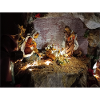 Illuminated Nativity Scene between Stones