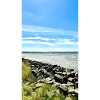 Coastal rocks in the blue sky