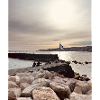 Sunset over pier and rocks