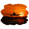 Airplane landing at sunset