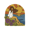 Woman by the sea at sunset