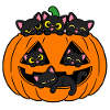 Katzen in einem Halloween-Kürbis