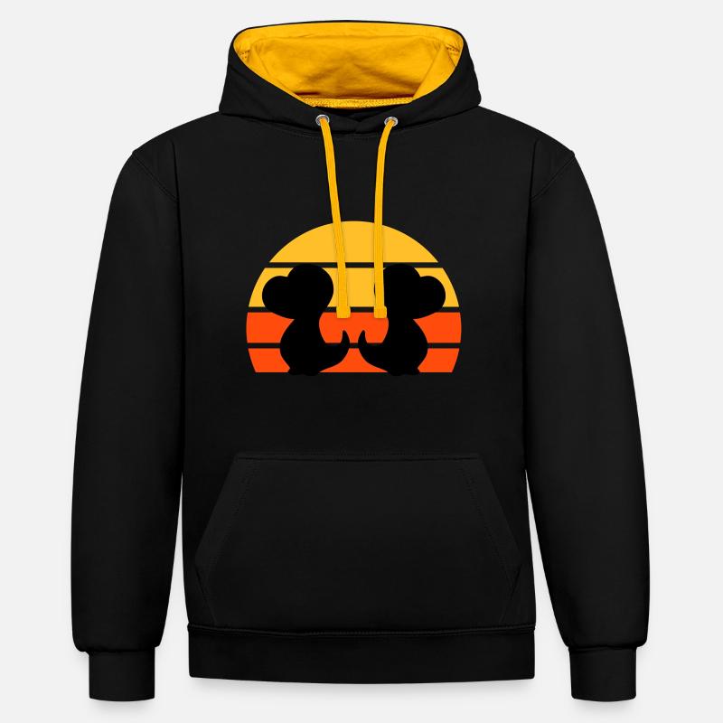 Zwei Dinosaurierbabys vor Halbsonne - Kontrast-Hoodie - Schwarz/Gold